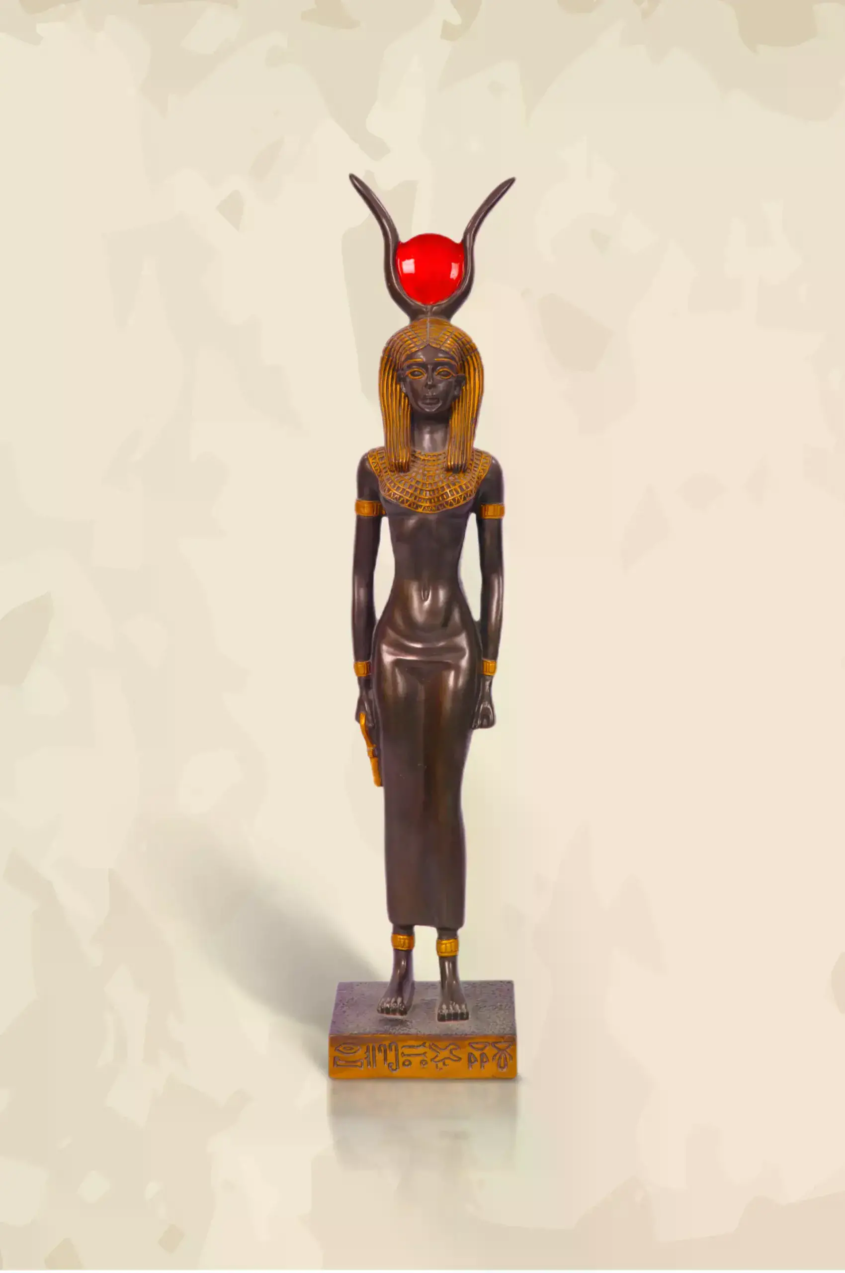 Black and golden statue of ancient egyptian queen Isis godess of magic and wisdom